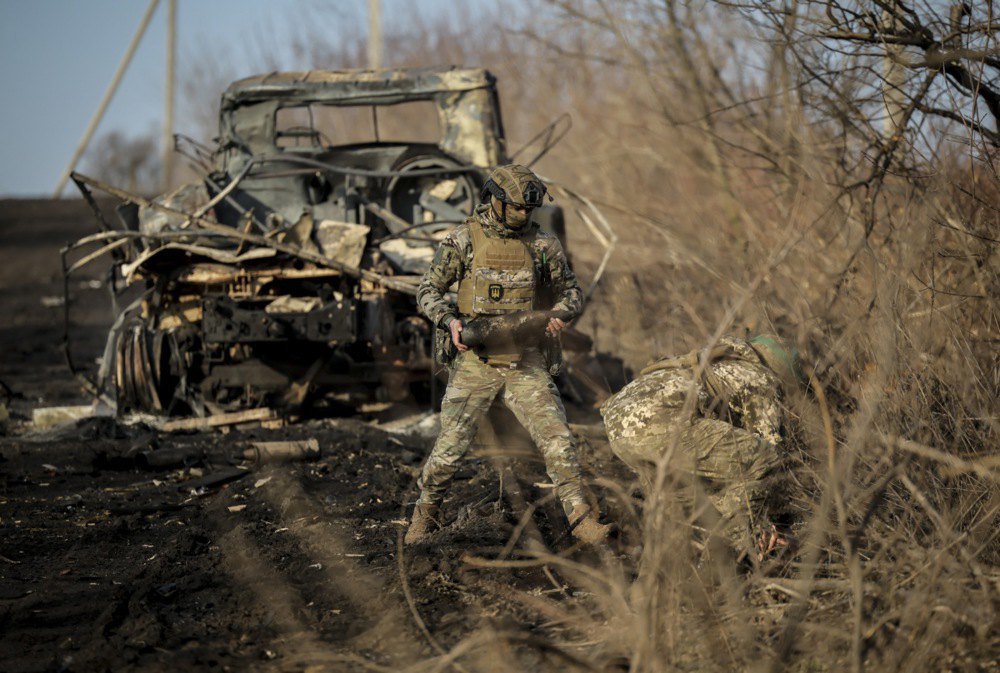 Servicemen of the engineering support group of the 24th separate mechanised brigade clear the rear road to Chasiv Yar, Donetsk Region, Ukraine, 13 January 2025.