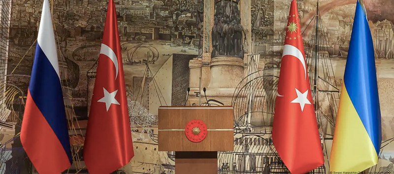 Flags of Ukraine, Russia and Turkey in the negotiations room in Istanbul, 2022