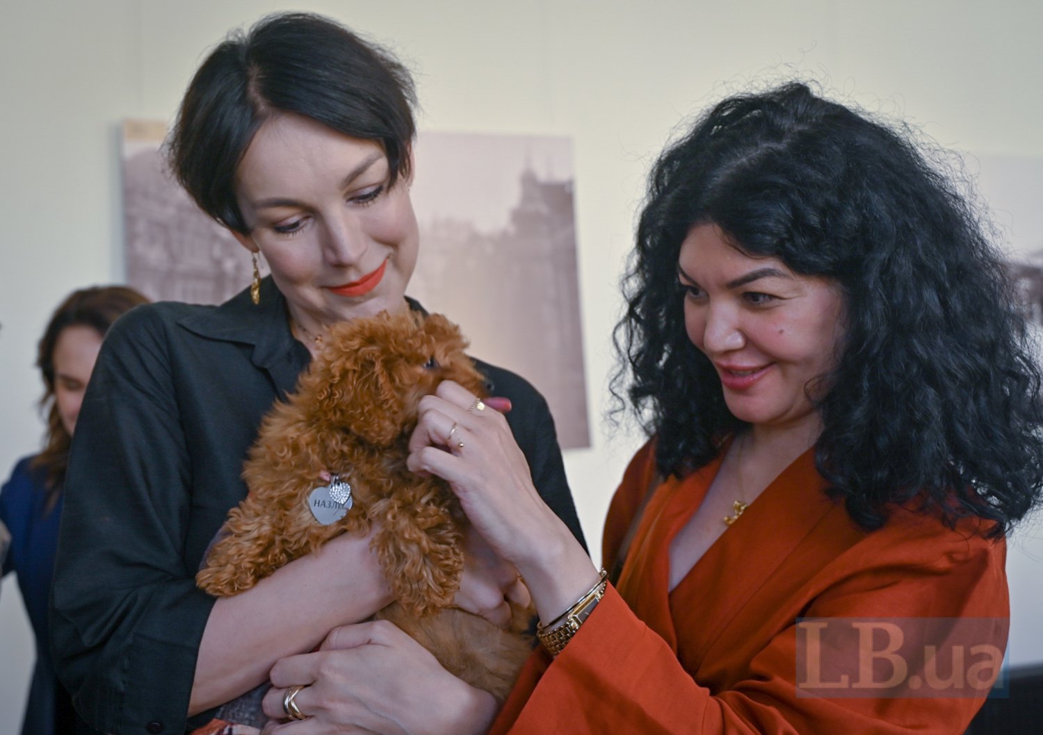 Sonya Koshkina holds Tamila Tasheva's beloved dog, named Nazly, in her arms.