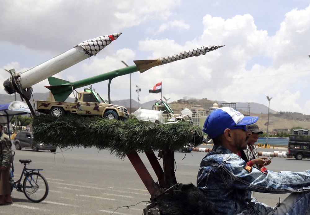 A man rides a motorcycle with imitation missiles in Sanaa, Yemen, 5 May 2025.