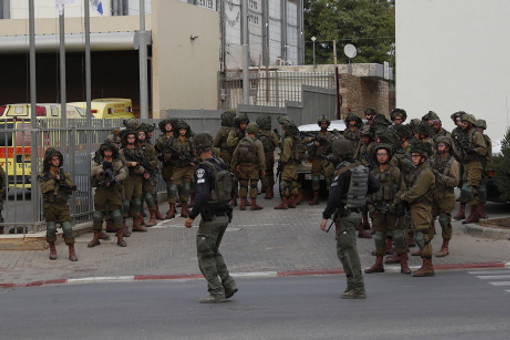 Israeli soldiers patrol the city of Sderot, 7 October 2023