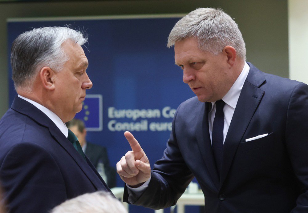 Hungarian Prime Minister Viktor Orban and Slovak Prime Minister Robert Fico talk before a special meeting of the European Council in Brussels, 1 February 2024