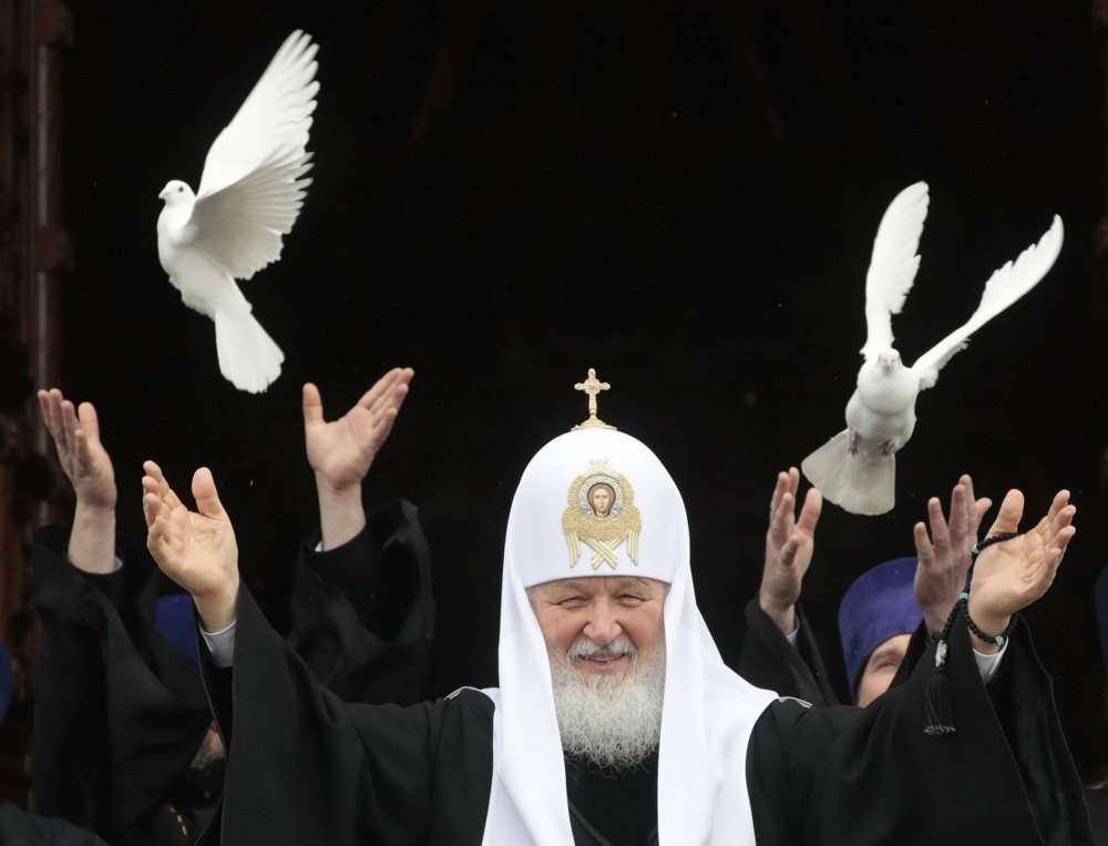 Patriarch Kirill releases pigeons after the service in the Cathedral of Christ the Saviour in Moscow, 7 April, 2020