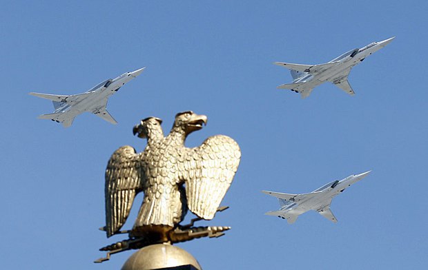 Attack aircraft flying above the Kremlin during a parade rehearsal.