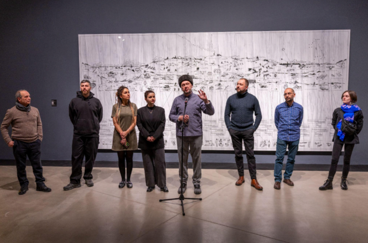 In the centre is the curator of the exhibition Kostyantyn Doroshenko