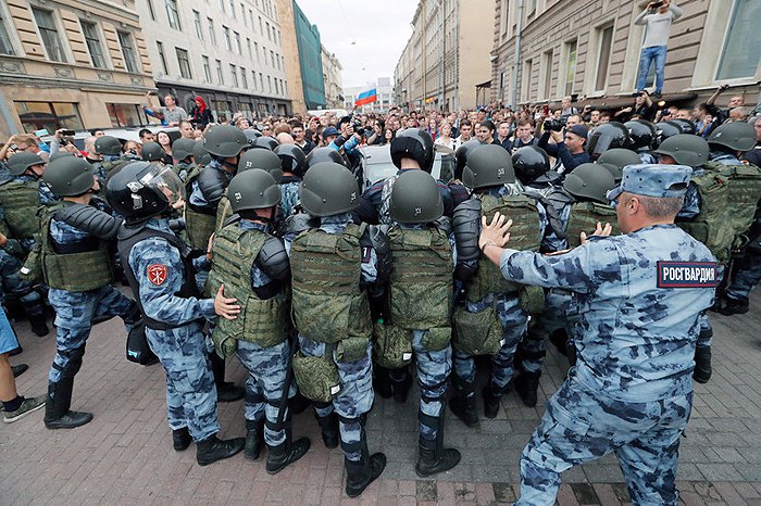 The Russian Guard blocks a protest against a planned increase in the retirement age, St Petersburg, 9 September 2018