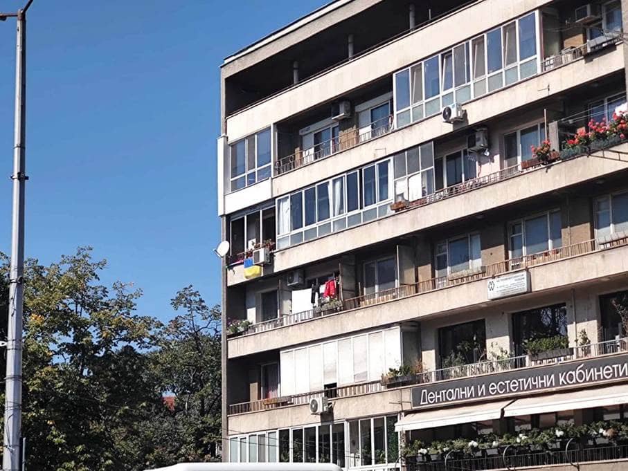 The Ukrainian flag flies on the balcony of an apartment in central Plovdiv.