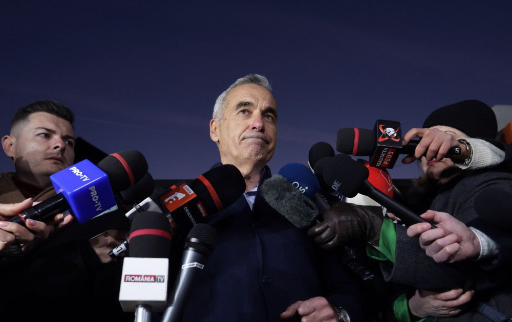 Far-right presidential candidate Călin Georgescu speaks to the media in front of his home after unexpectedly winning the first round of the presidential election, Izvoran, Romania, 26 November 2024.