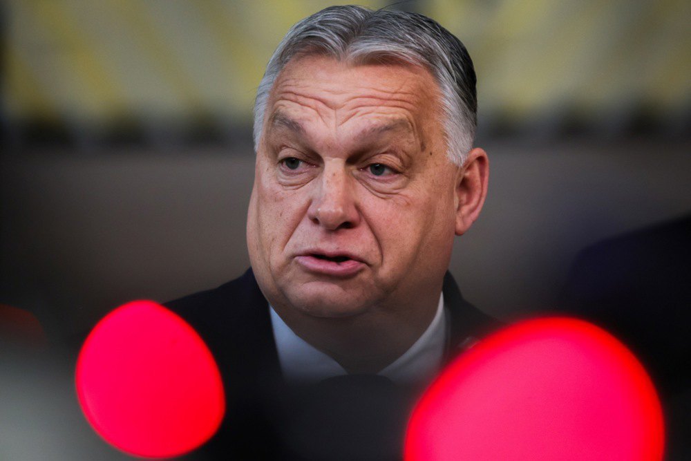 Hungarian Prime Minister Viktor Orban (L) arrives for a meeting of the European Council in Brussels, 14 December 2023 