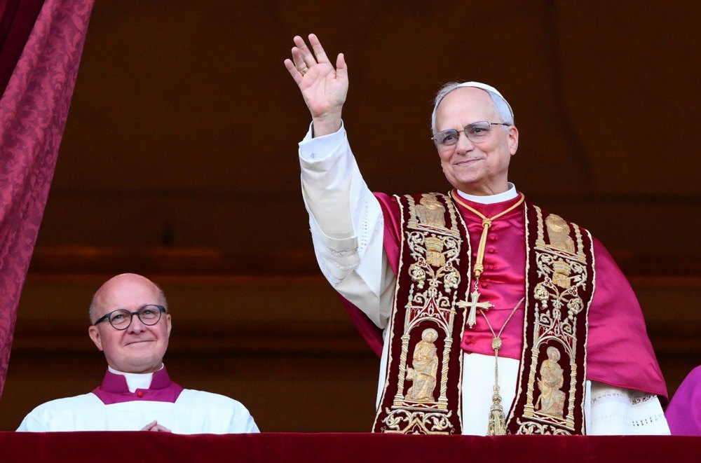 The newly elected Pope Leo XIV, Cardinal Robert Francis Prevost of the United States, blesses the faithful from the central loggia of St. Peter's Basilica in the Vatican, 8 May, 2025.