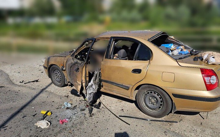 Russian drone strike hits civilian car in Kherson, killing two men