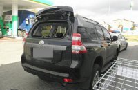 На киевской заправке у водителя Land Cruiser забрали сумку с миллионом гривен