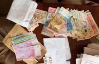 В ходе обысков в Фонд по потере трудоспособности изъяли 2,6 млн гривен