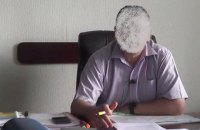 Голові РДА Київської області повідомлено про підозру у незаконній передачі в оренду 50 га землі